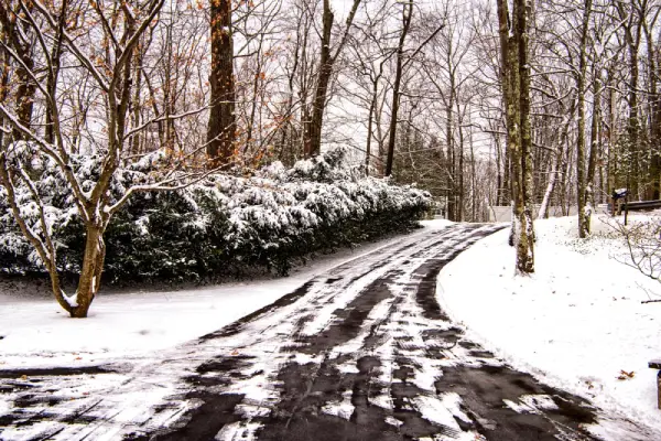 driveway-cleared-on-snow-in-the-winter.webp