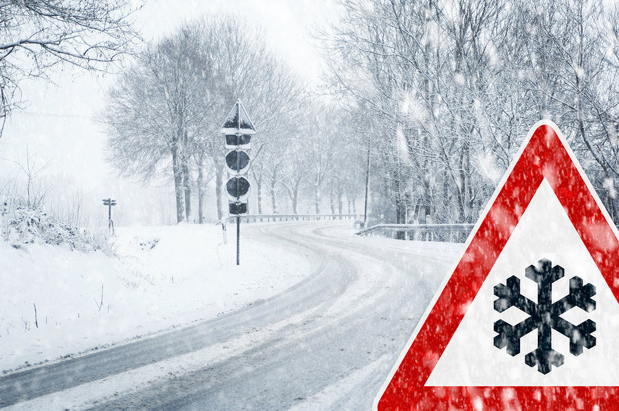 bigstock-Snowy-curvy-road-with-traffic-52849951.jpg